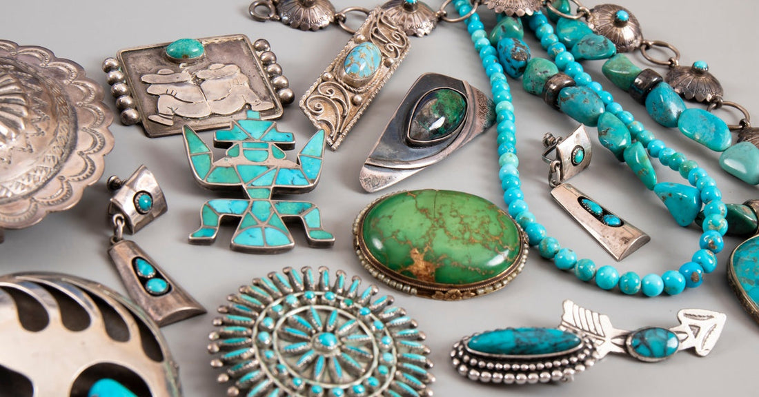 An array of turquoise and silver Native American jewelry pieces, including necklaces, pendants, and more.